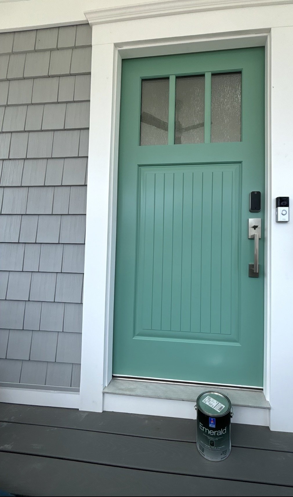 After painting: the same front door finished sea green, with hardware reinstalled